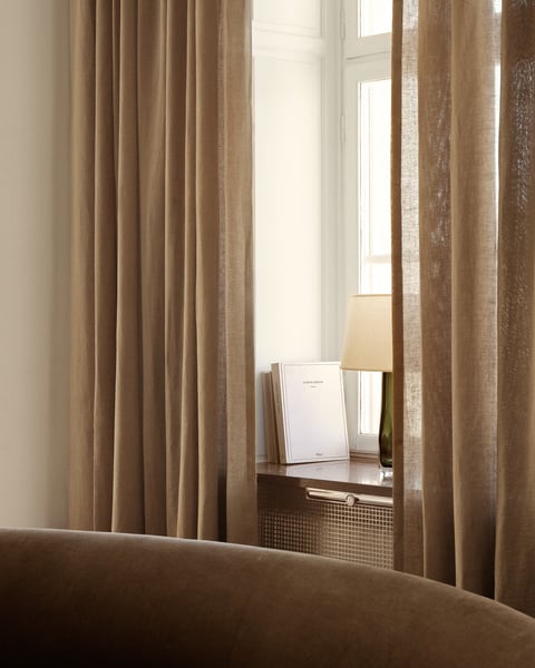 Breezy sheer curtains framing a patio door