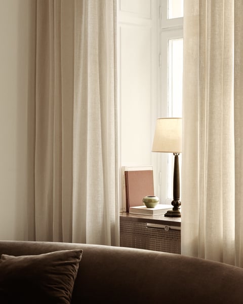 Modern sheer curtains layered with blackout drapes