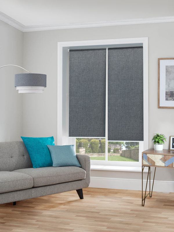 Roller blinds on a wide window panel