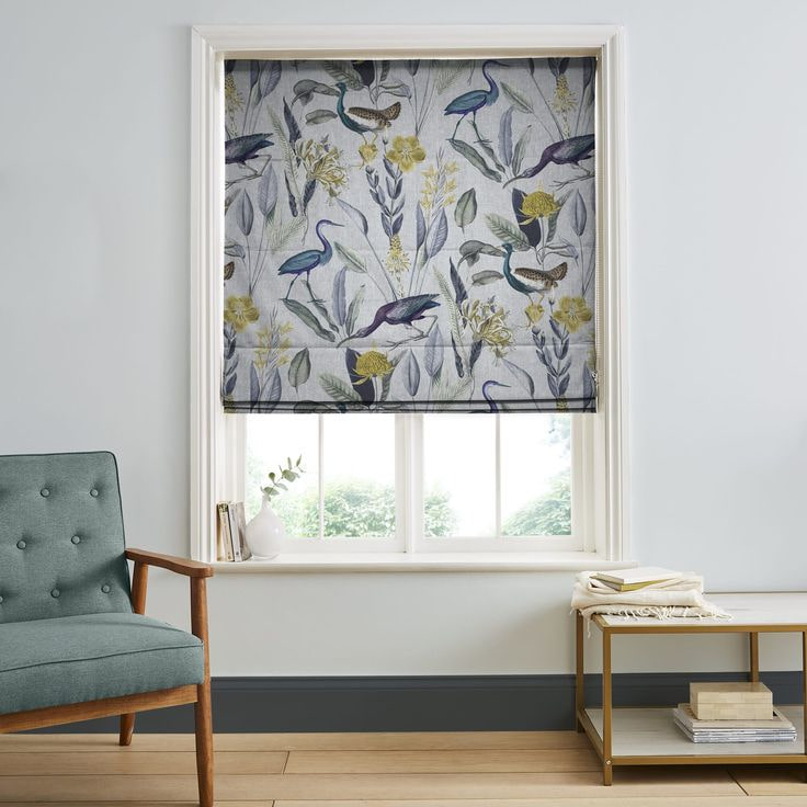 Roman blinds lifted to allow light in.