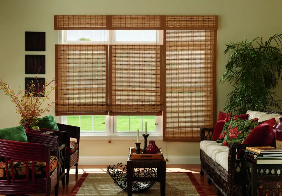 Natural bamboo blinds covering a window with soft sunlight filtering through